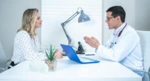 Doctor discussing non-surgical arthritis treatments with patient